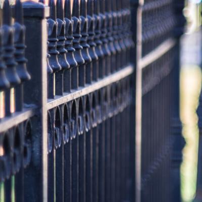 Vertical Closeup Shot Metal Fence Sidewalk Min